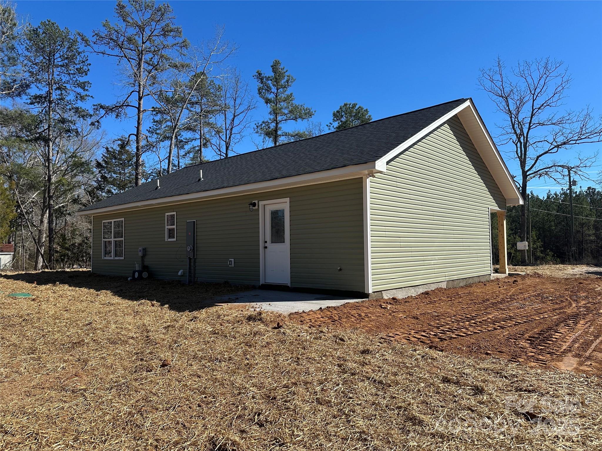 3537 Taxahaw Road Lancaster, SC 29720 - Photo 8 of 8 a front view of house with yard and trees in the background