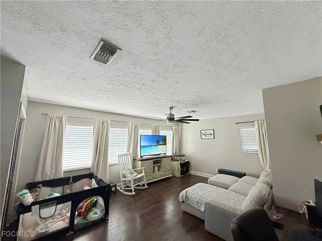 a room with furniture a window and a wooden floor