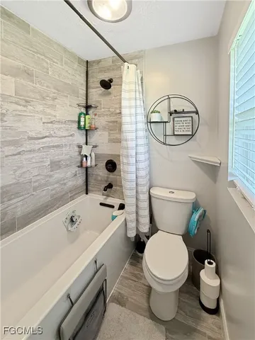 a bathroom with a toilet a sink and a bathtub