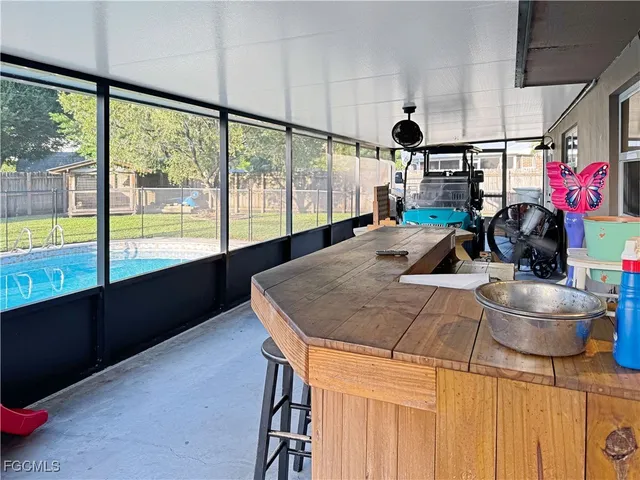 a room with lots of counter space and windows