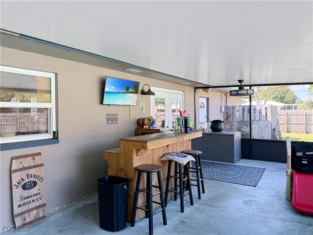 a view of a dining room with furniture and window