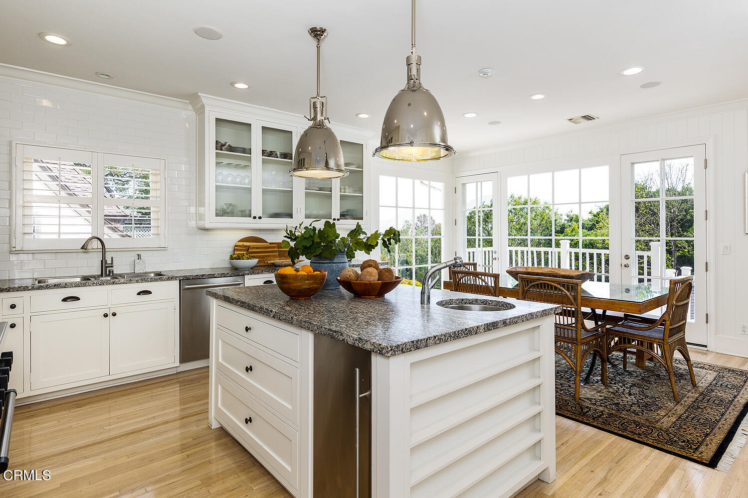 780 Huntington Circle Pasadena, CA 91106 - Photo 20 of 55 a kitchen with stainless steel appliances granite countertop a stove a sink dishwasher and white cabinets with wooden floor