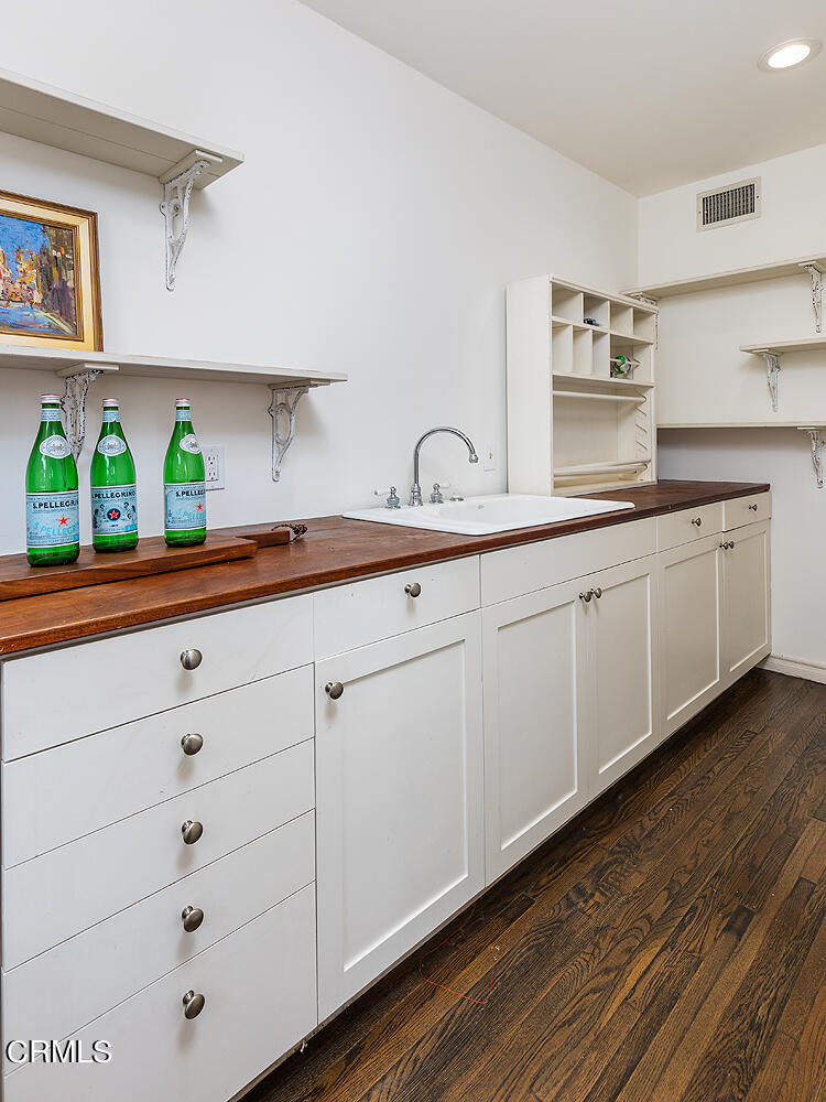 780 Huntington Circle Pasadena, CA 91106 - Photo 36 of 55 a kitchen with stainless steel appliances a sink and white cabinets