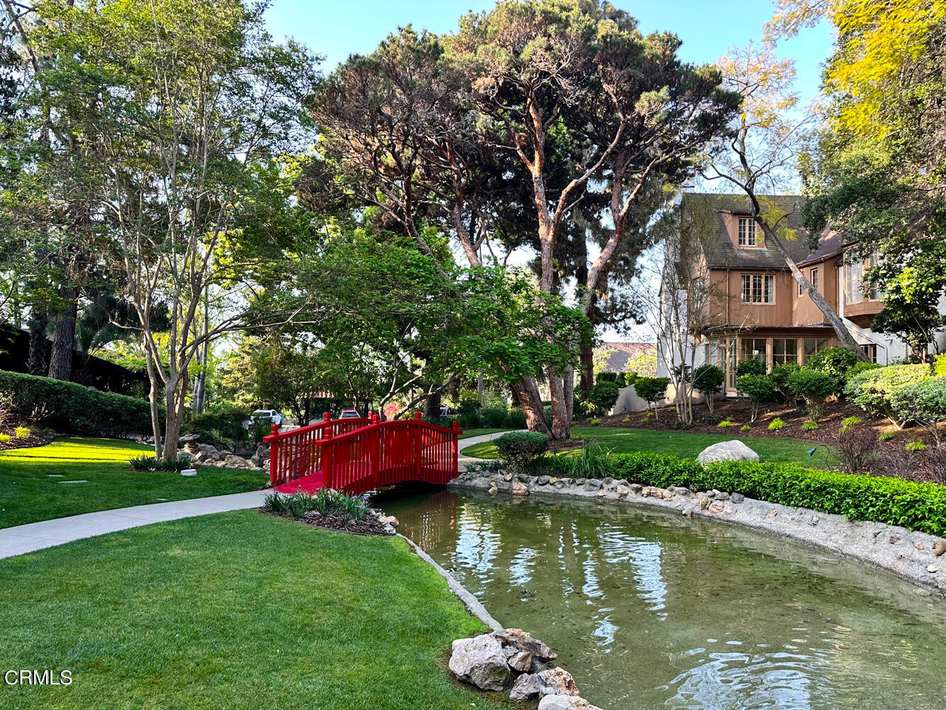 780 Huntington Circle Pasadena, CA 91106 - Photo 52 of 55 a view of a lake with a house in the background