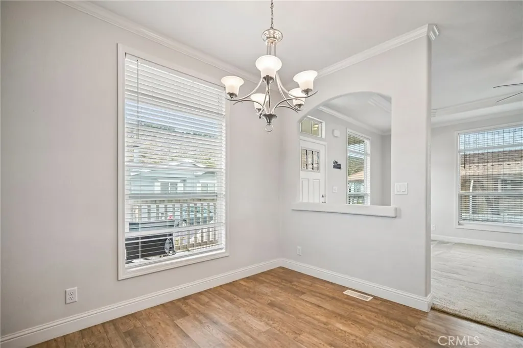 250 East Telegraph Road, Unit 307 Fillmore, CA 93015 - Photo 8 of 36 a view of an room with chandelier fan and windows