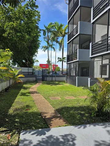 a house view with a garden space
