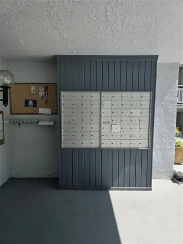 a kitchen with wooden cabinets and a fireplace