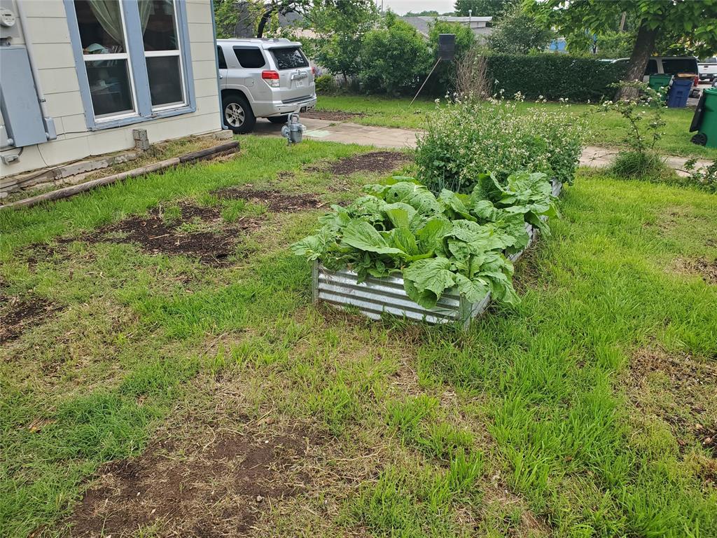 300 North Church Street Decatur, TX 76234 - Photo 18 of 19 a white house with lots of green space