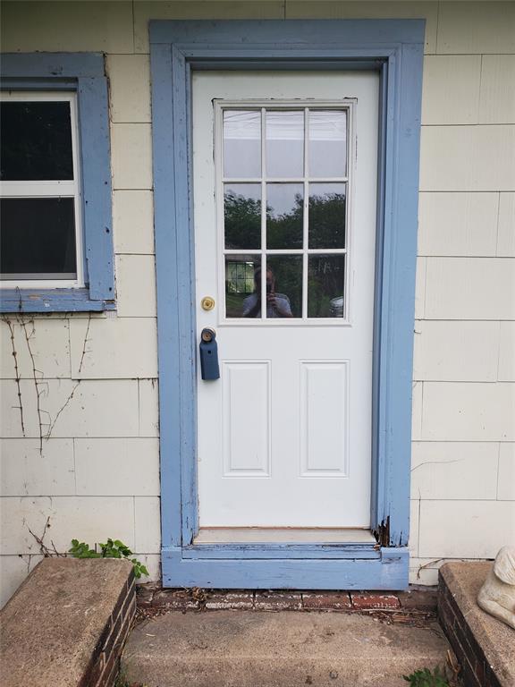 300 North Church Street Decatur, TX 76234 - Photo 2 of 19 a view of a door and a window