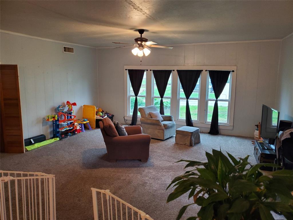 300 North Church Street Decatur, TX 76234 - Photo 3 of 19 a living room with furniture and a large window
