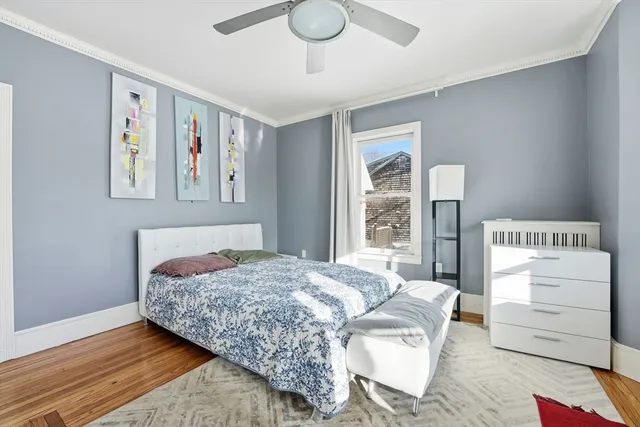 a bedroom with a bed and a dresser