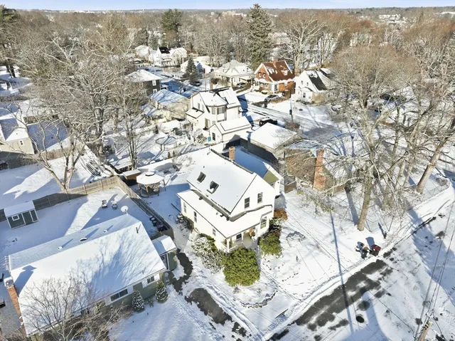 an aerial view of multiple house with yard