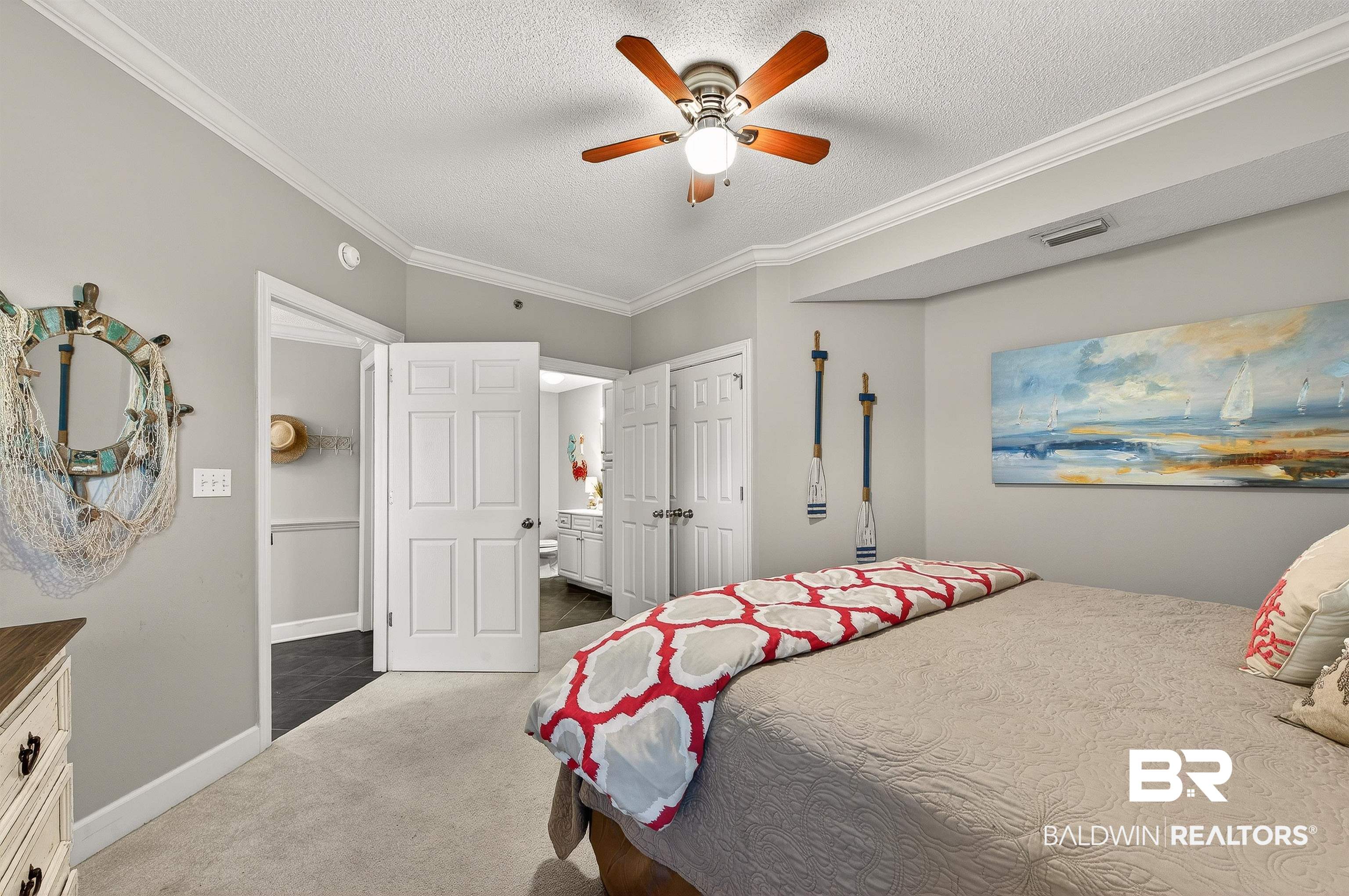 27582 Canal Road, Unit 2507 Orange Beach, AL 36561 - Photo 37 of 75 Carpeted bedroom featuring ornamental molding, a ceiling fan, and a textured ceiling