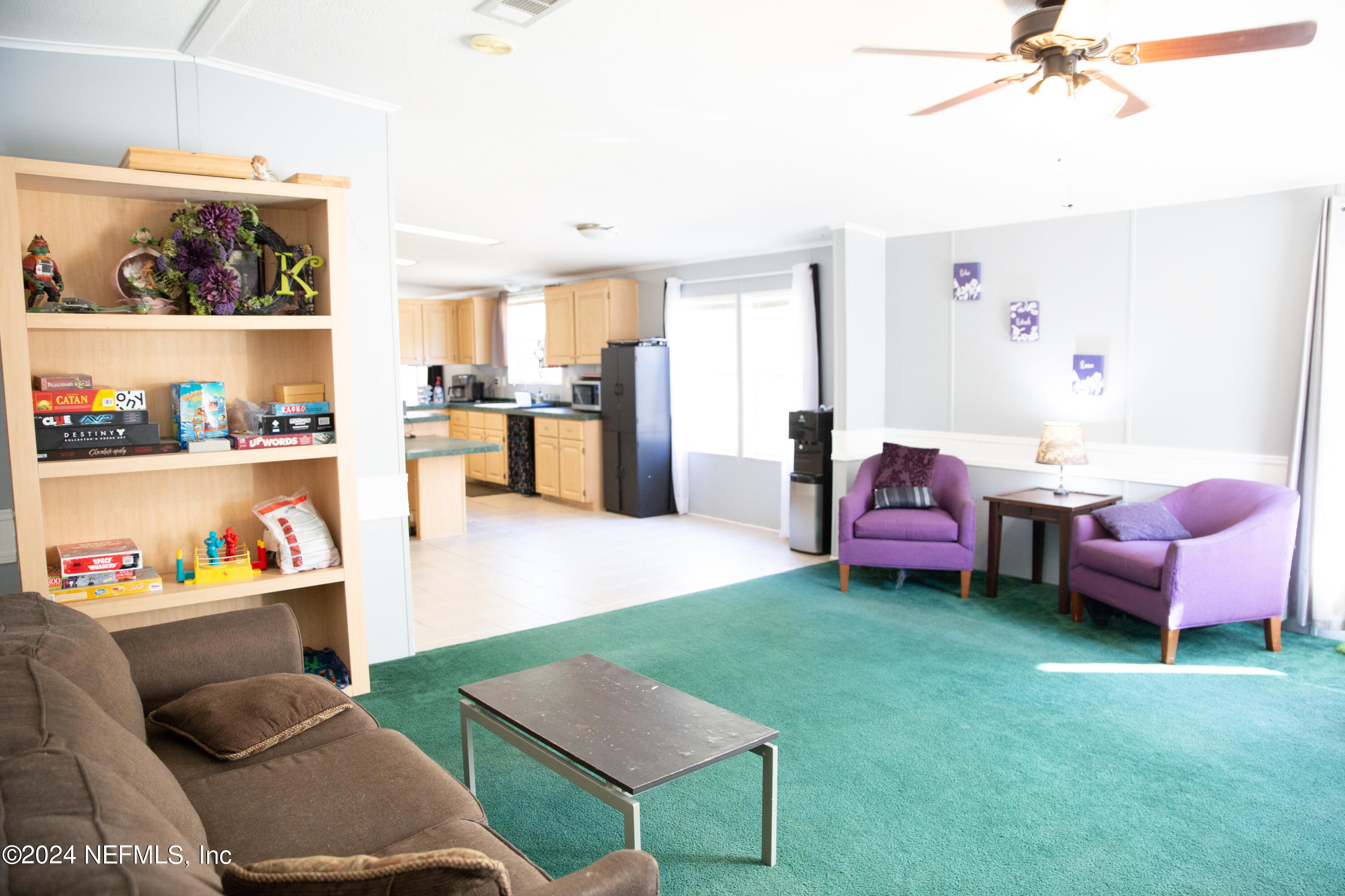 5518 Long Branch Cemetery Road Jacksonville, FL 32234 - Photo 14 of 22 a living room with furniture and a kitchen view