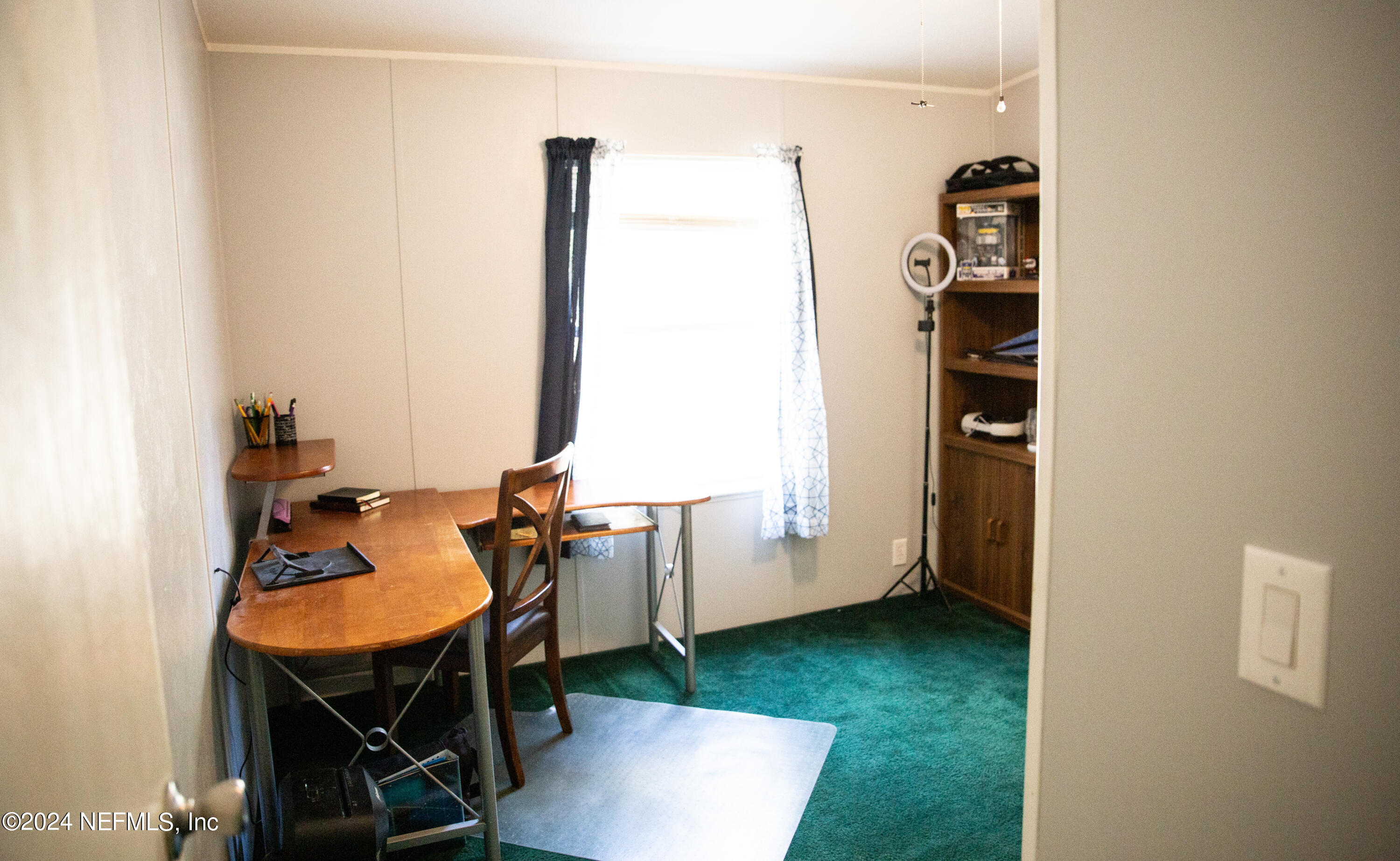 5518 Long Branch Cemetery Road Jacksonville, FL 32234 - Photo 17 of 22 wooden floor with table and a workspace