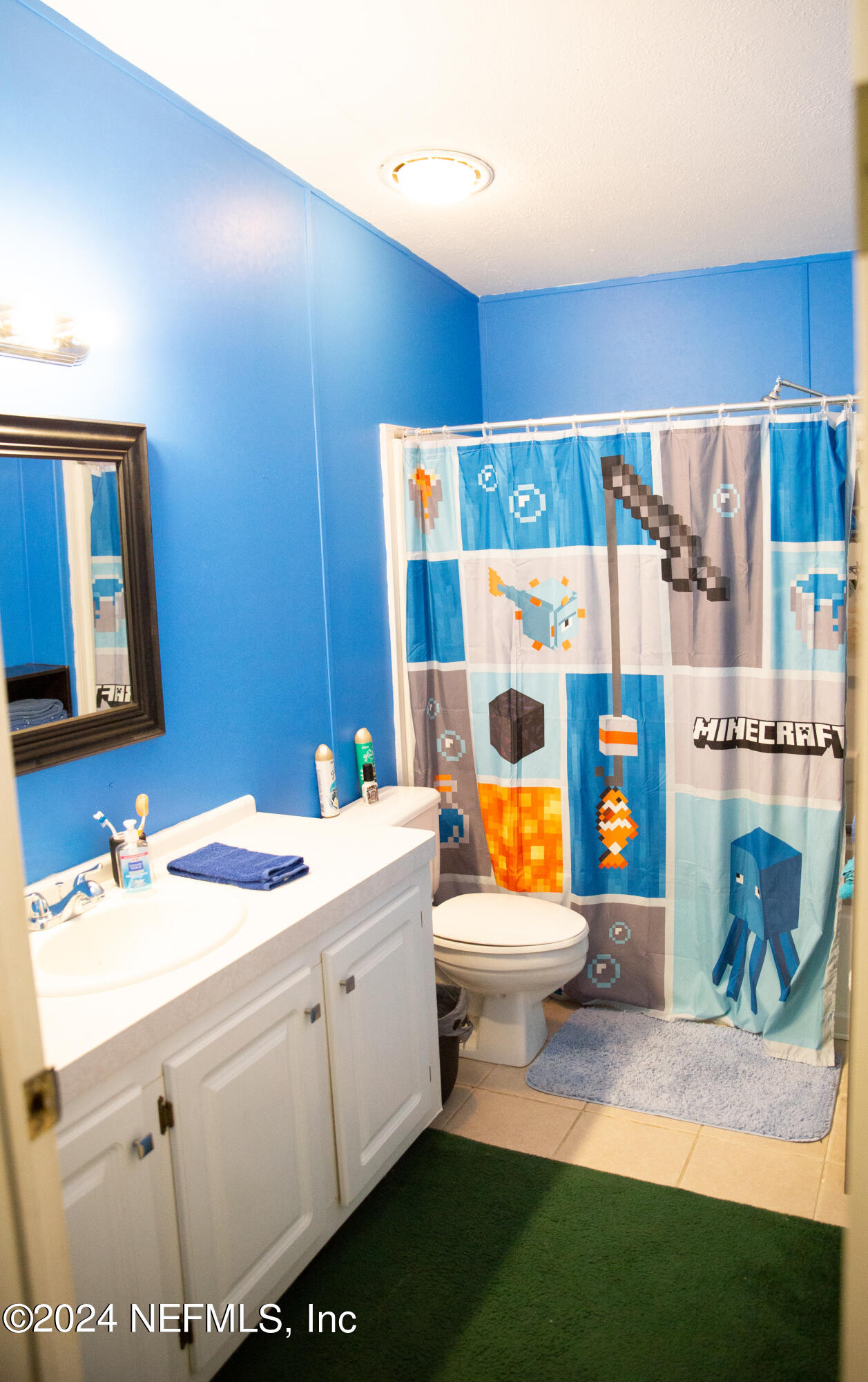 5518 Long Branch Cemetery Road Jacksonville, FL 32234 - Photo 19 of 22 a bathroom with a sink toilet and mirror