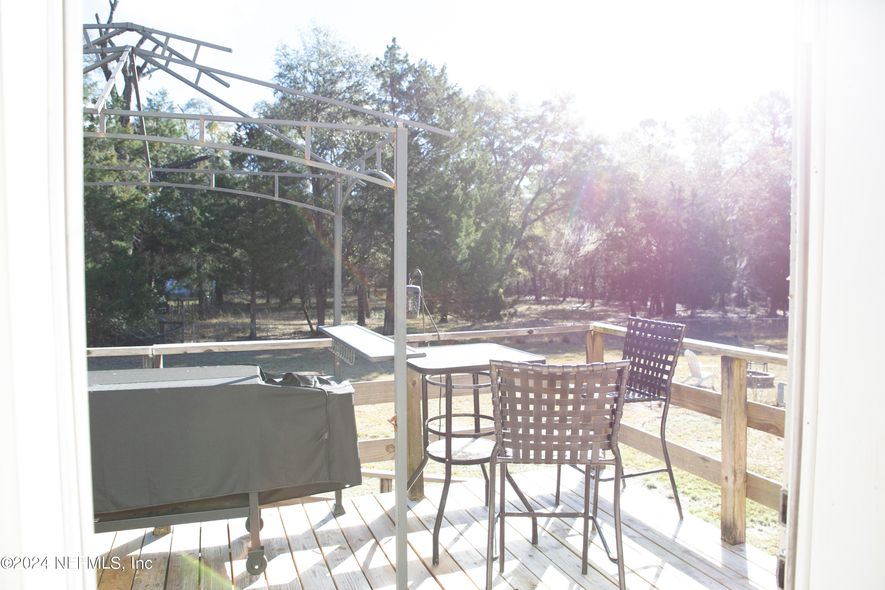 5518 Long Branch Cemetery Road Jacksonville, FL 32234 - Photo 20 of 22 a view of outdoor dining space with a backyard