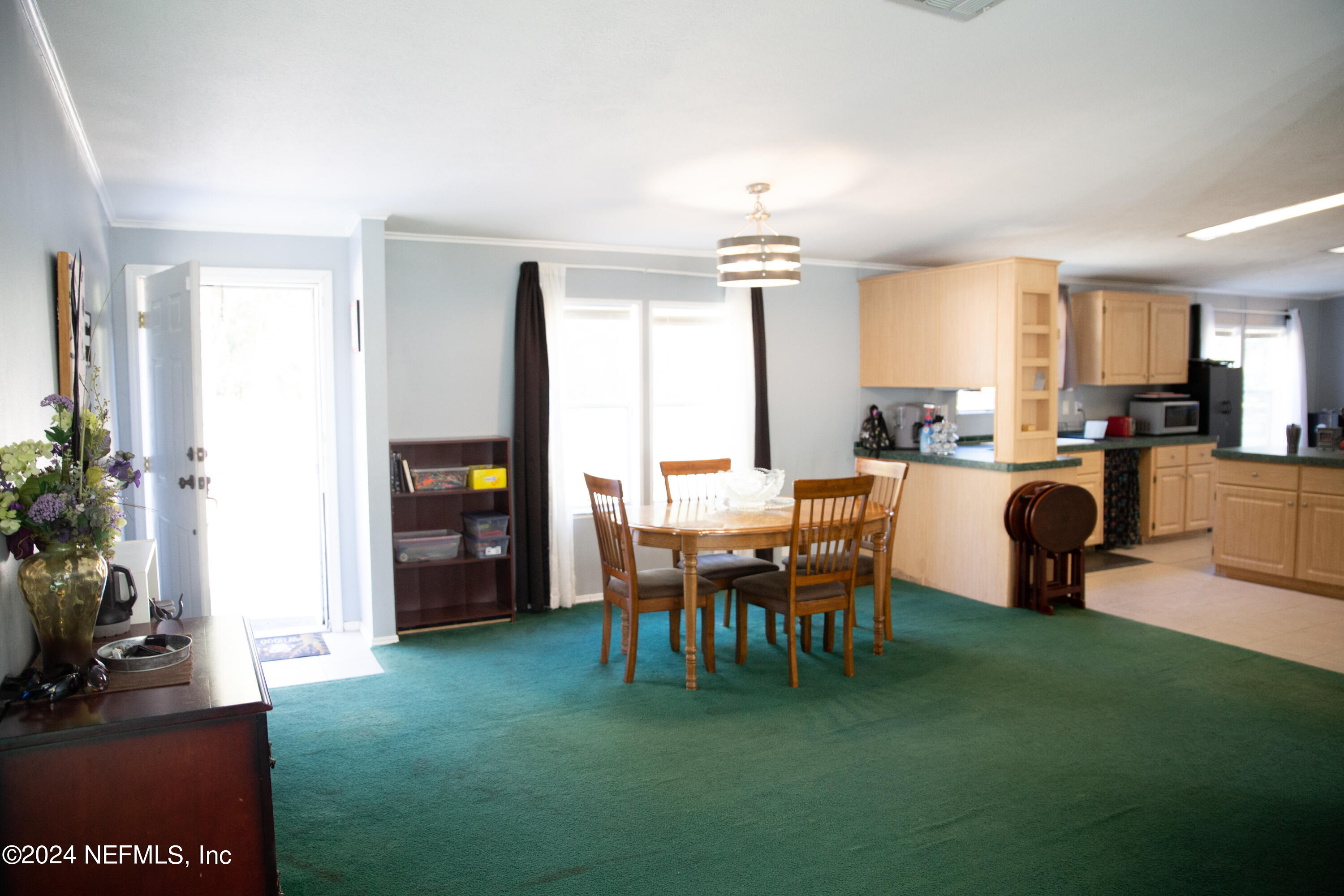 5518 Long Branch Cemetery Road Jacksonville, FL 32234 - Photo 5 of 22 a dining room with furniture and a kitchen view