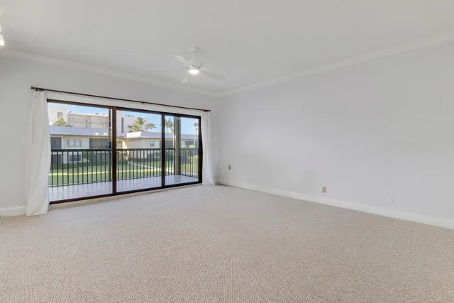 a view of an empty room with a balcony