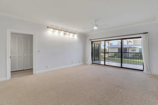 a view of an empty room with a sliding door