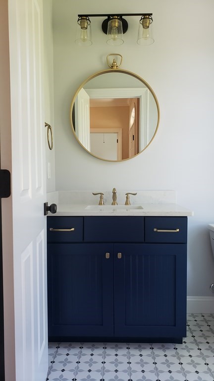 6 Quigley Road Southampton, MA 01073 - Photo 15 of 24 a bathroom with a sink and a mirror