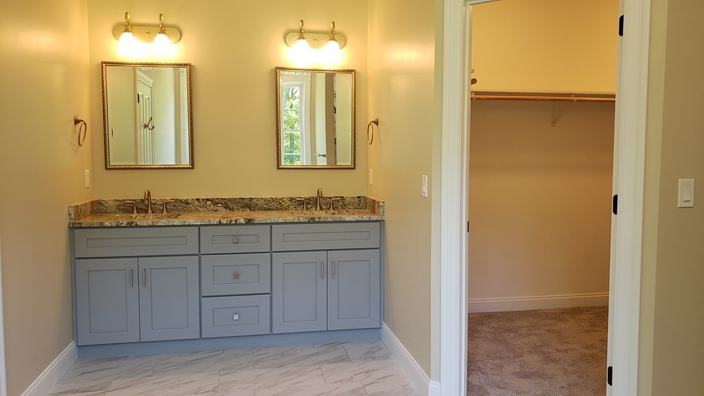 6 Quigley Road Southampton, MA 01073 - Photo 18 of 24 a bathroom with a granite countertop sink and a mirror