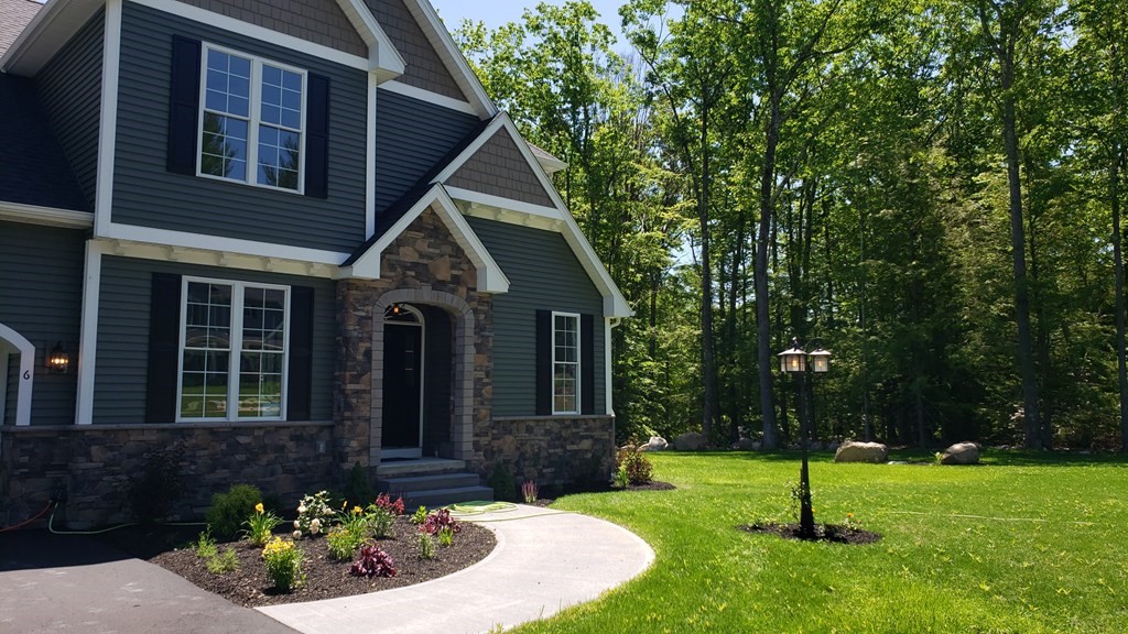6 Quigley Road Southampton, MA 01073 - Photo 3 of 24 a front view of a house with a yard