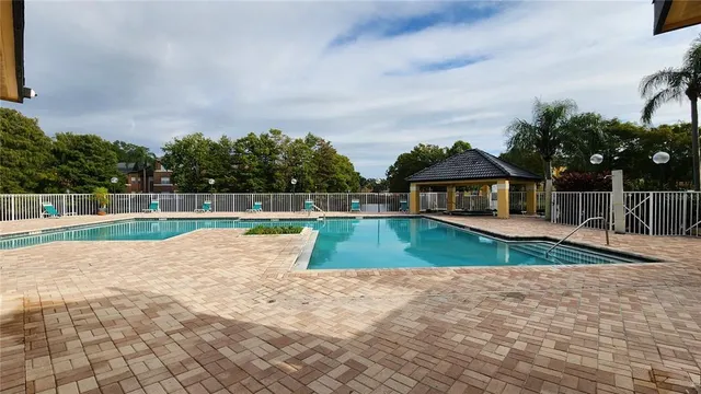 a view of swimming pool with a yard