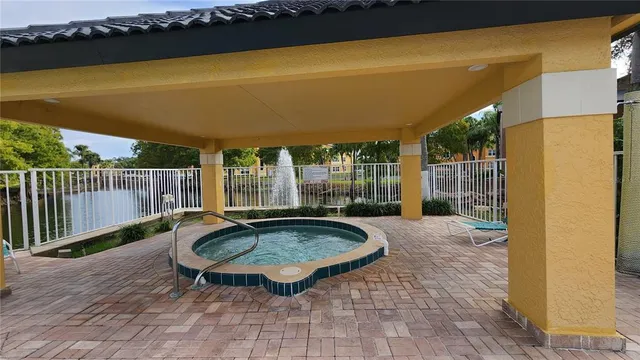 a view of swimming pool with seating space