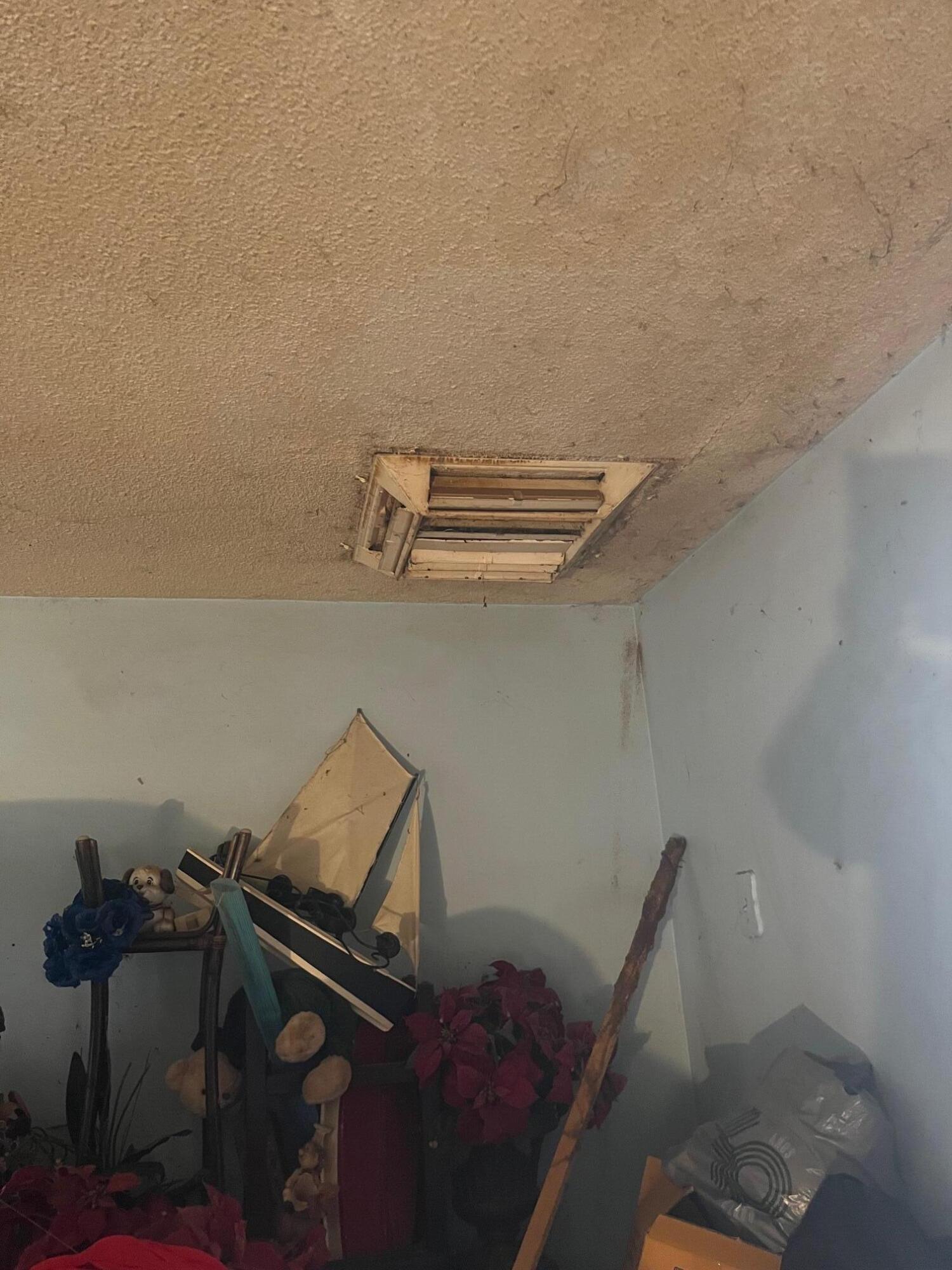 239 Ave P-3 Palmdale, CA 93550 - Photo 3 of 5 a view of storage and utility room with racks on the wall