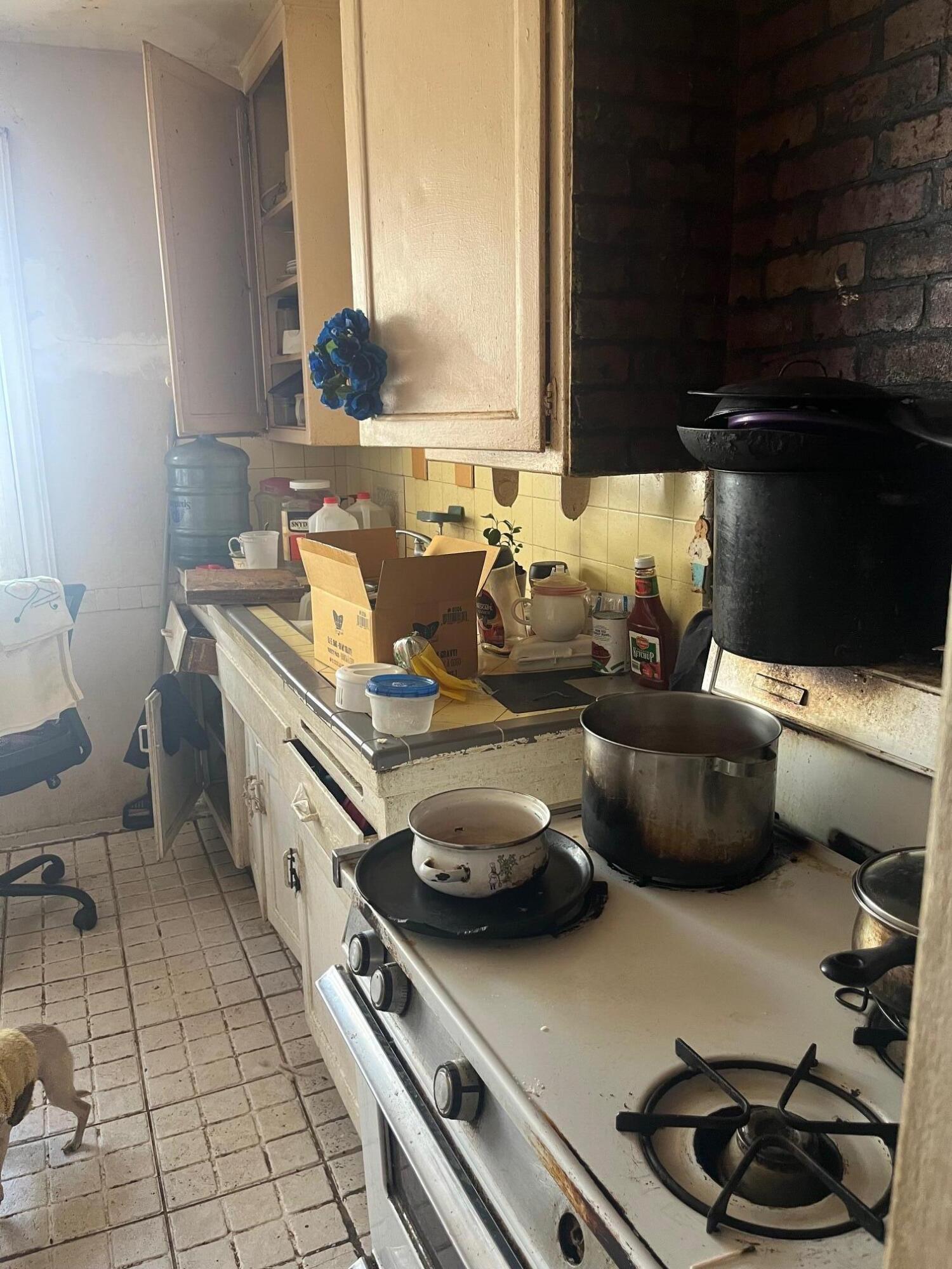 239 Ave P-3 Palmdale, CA 93550 - Photo 4 of 5 a kitchen with stainless steel appliances a sink and a stove