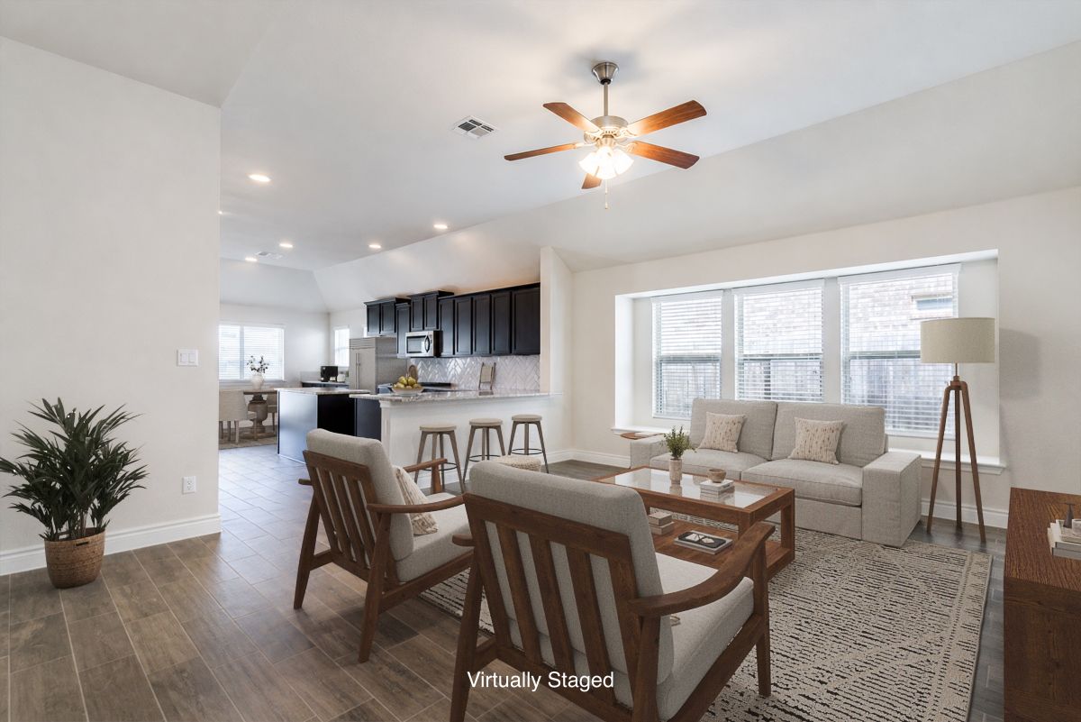 124 Compass Lane Kyle, TX 78640 - Photo 3 of 38 a living room with furniture and a large window