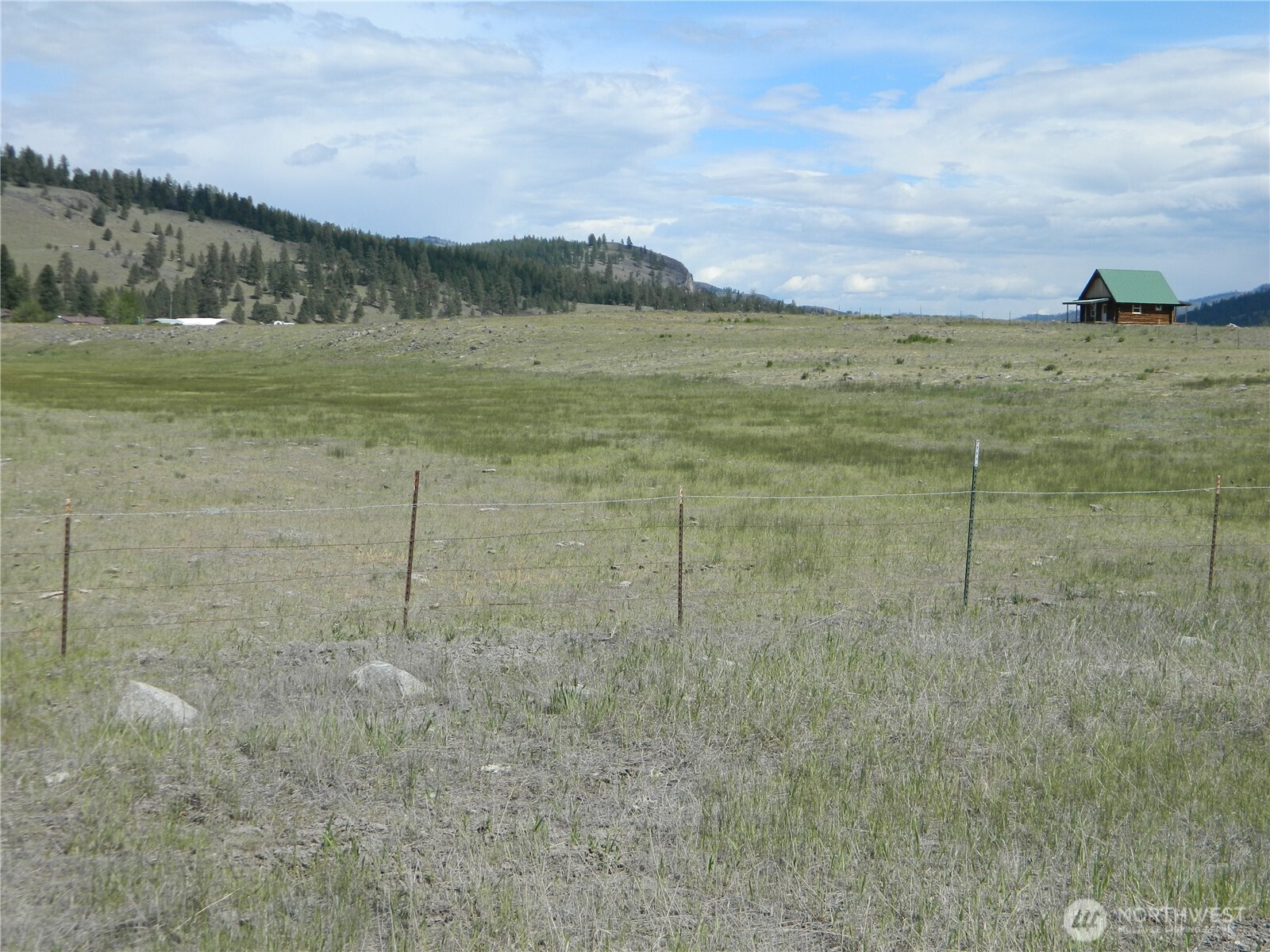 4 Duck Flats Road Tonasket, WA 98855 - Photo 2 of 6 a view of a lake with a mountain in the background