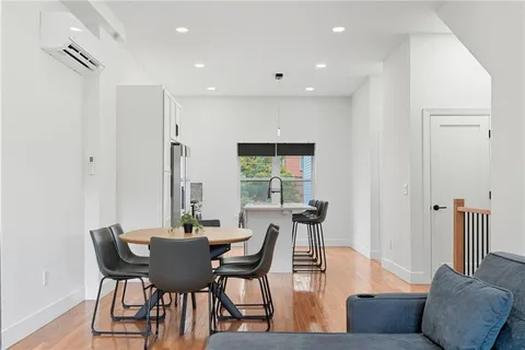 a view of a dining room with furniture and a table