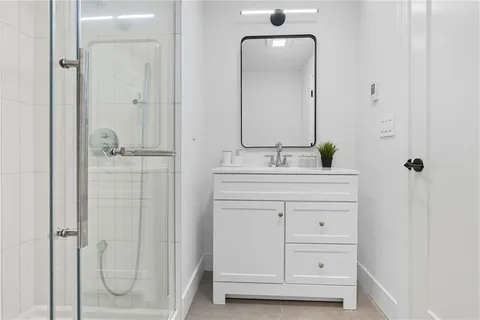 a bathroom with a double vanity sink mirror and