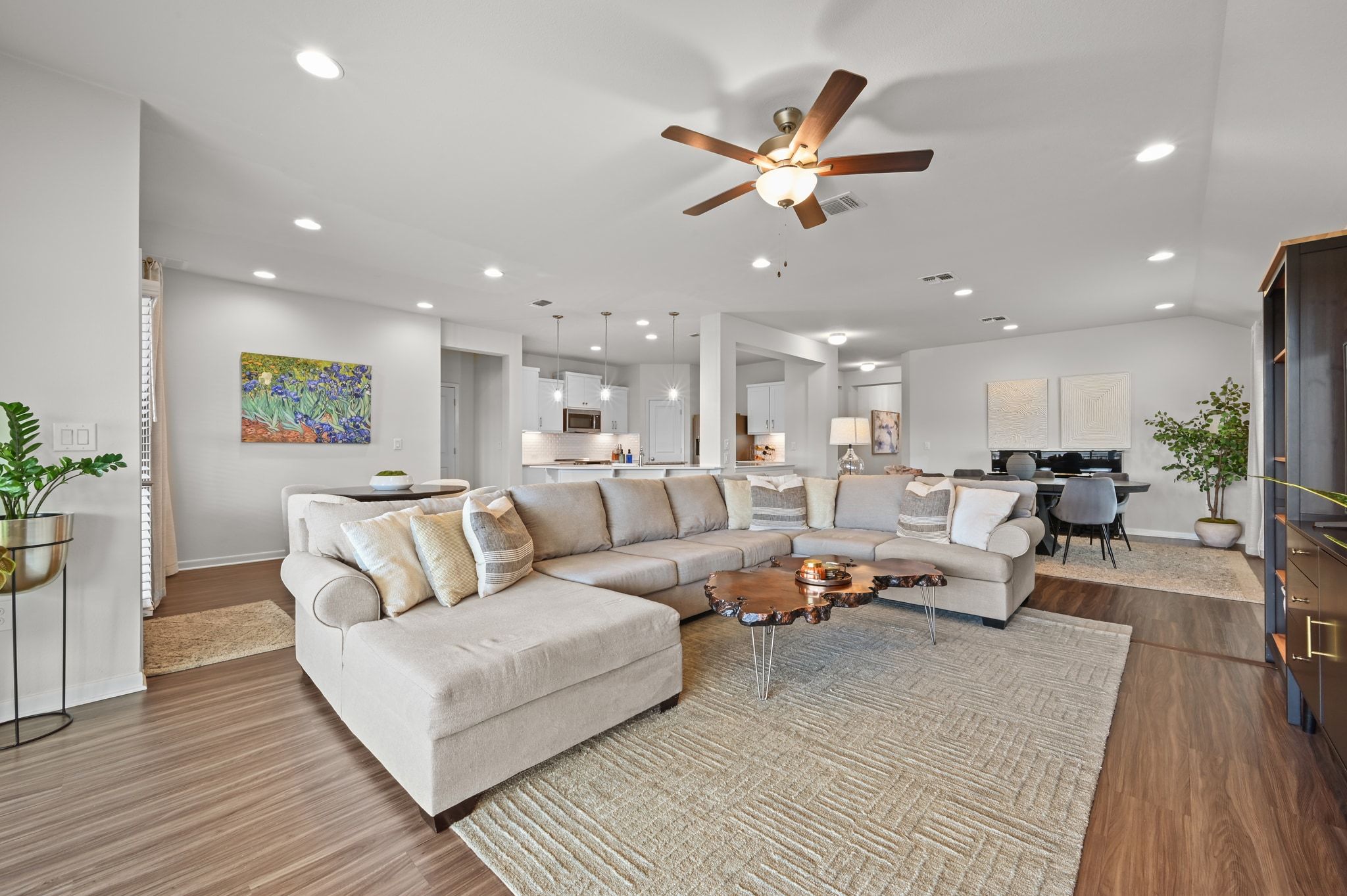 16620 Sumptuous Drive Manor, TX 78653 - Photo 11 of 40 Open concept living room with wood finished vinyl floors, and recessed lighting