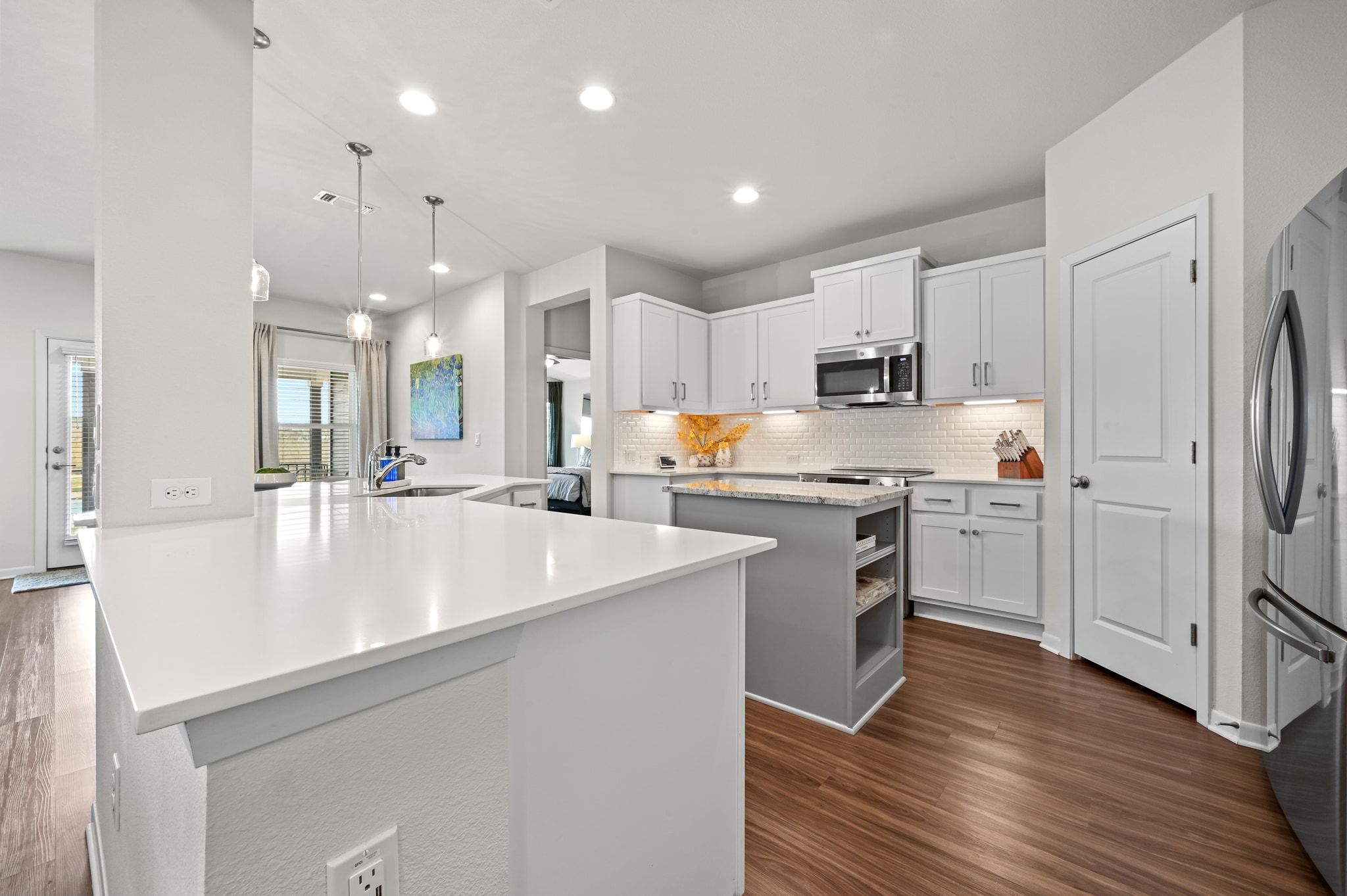 16620 Sumptuous Drive Manor, TX 78653 - Photo 16 of 40 Open concept kitchen with island with built in cookbook nook.