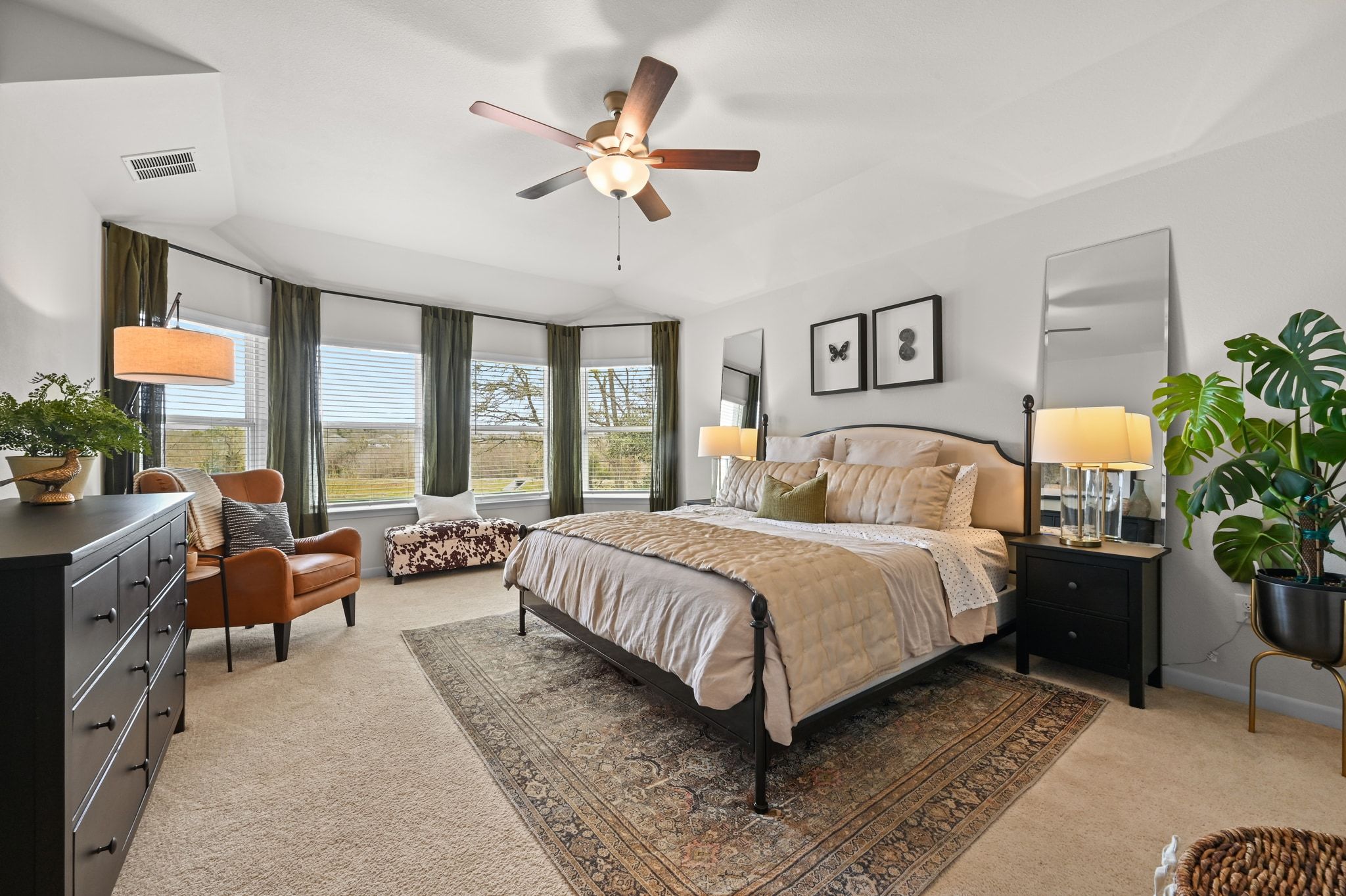 16620 Sumptuous Drive Manor, TX 78653 - Photo 17 of 40 Primary bedroom featuring upgraded bay window, and lofted ceiling