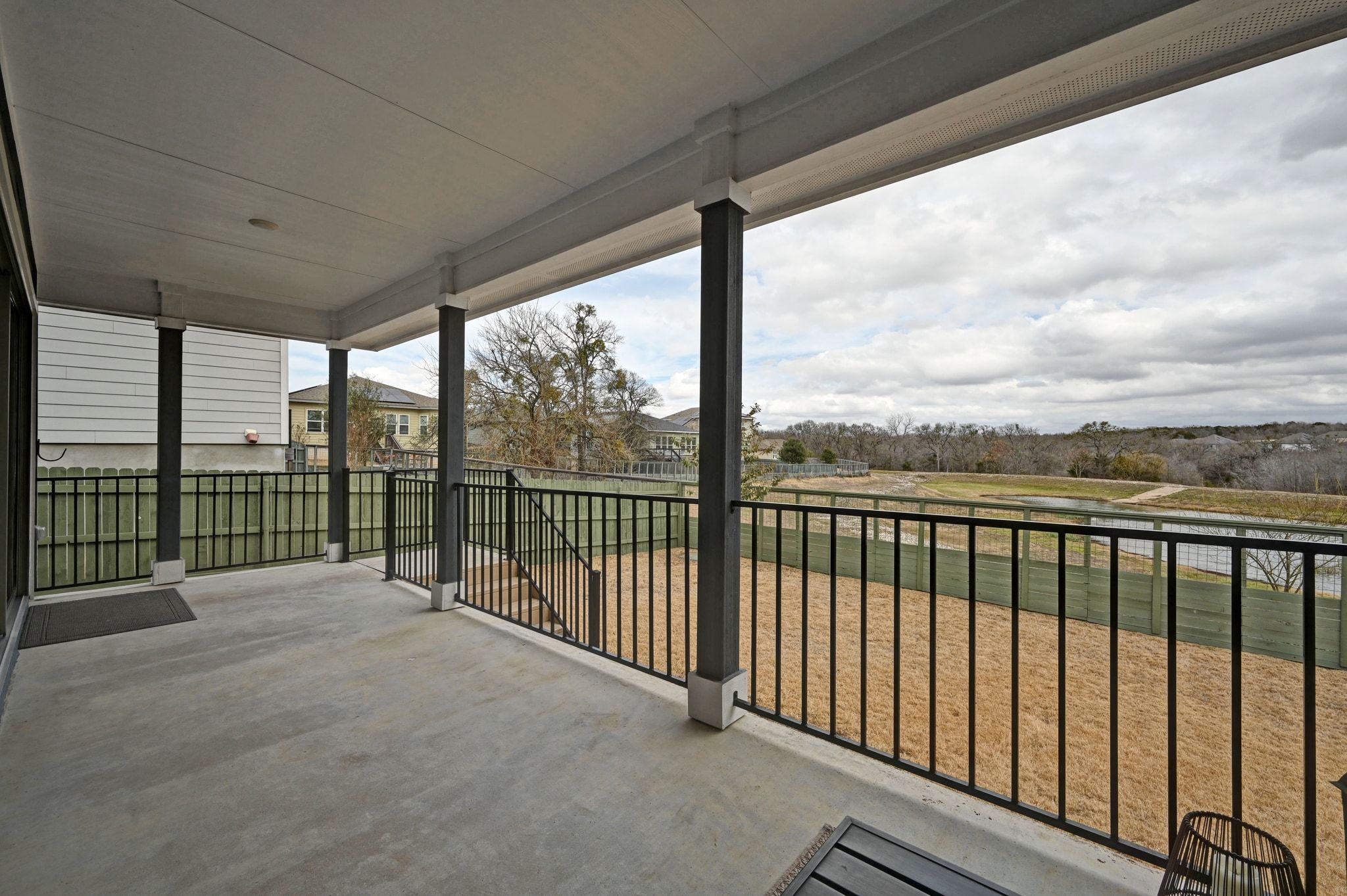 16620 Sumptuous Drive Manor, TX 78653 - Photo 25 of 40 Sizable back patio large enough for patio seating with gorgeous natural views.