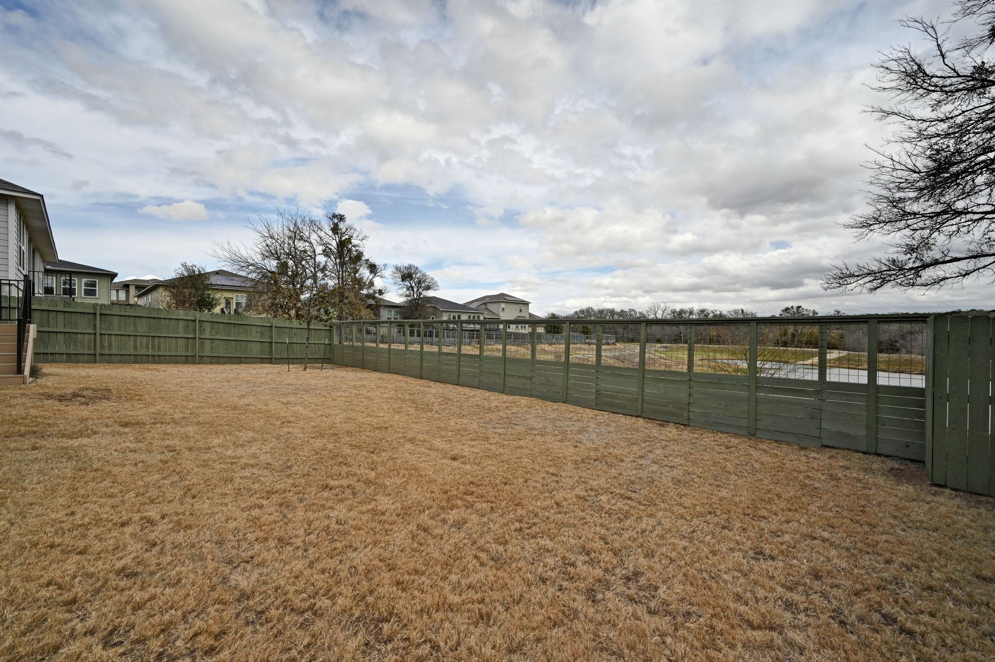 16620 Sumptuous Drive Manor, TX 78653 - Photo 31 of 40 Fenced backyard with freshly stained fencing.