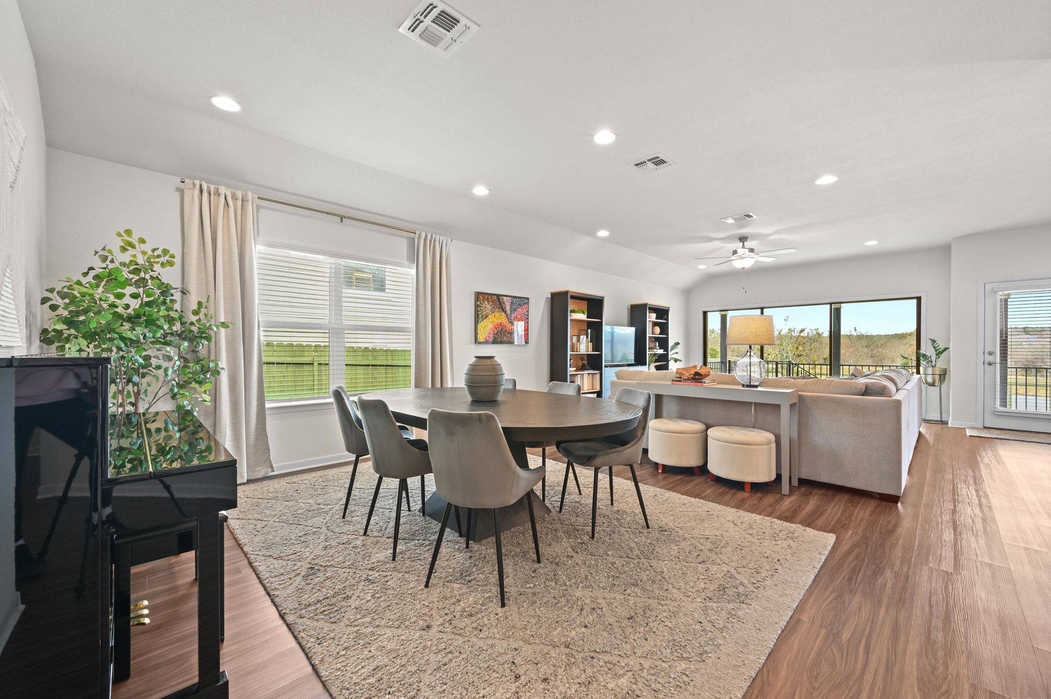 16620 Sumptuous Drive Manor, TX 78653 - Photo 7 of 40 Open concept dining room with abundant natural light, dark wood finished floors, and recessed lighting