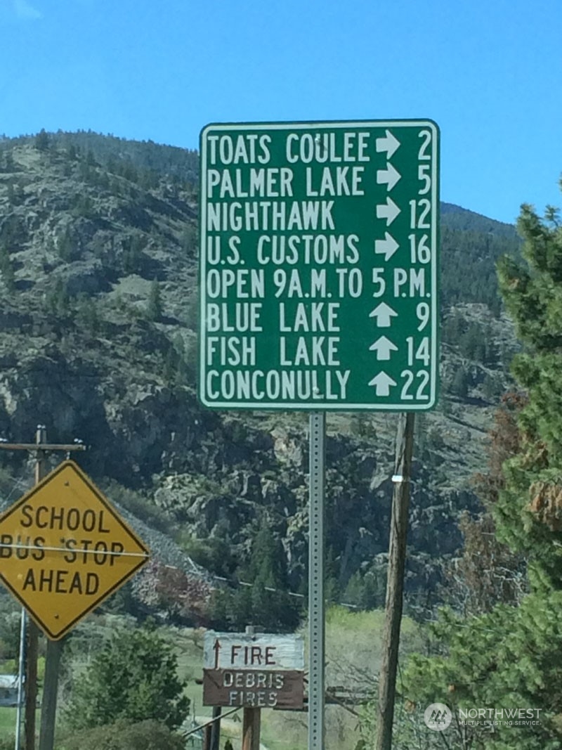 0 Palmer Lake Loomis, WA 98827 - Photo 4 of 30 a sign that is sitting on a brick wall
