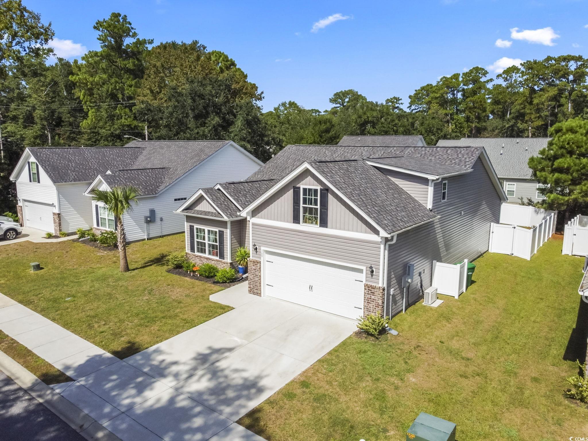 308 Concorde Drive Georgetown, SC 29440 - Photo 2 of 40 View of front of property with a garage, 4 car driveway, a nice front lawn
