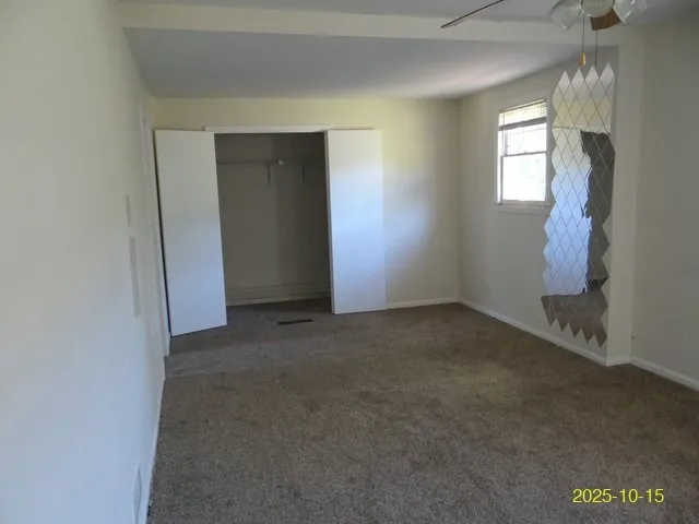a bathroom with a tub sink vanity and mirror