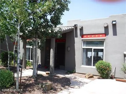 a view of a building with potted plants