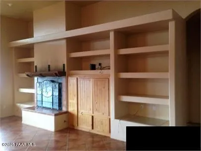 a view of a glass door with wooden floor and a window