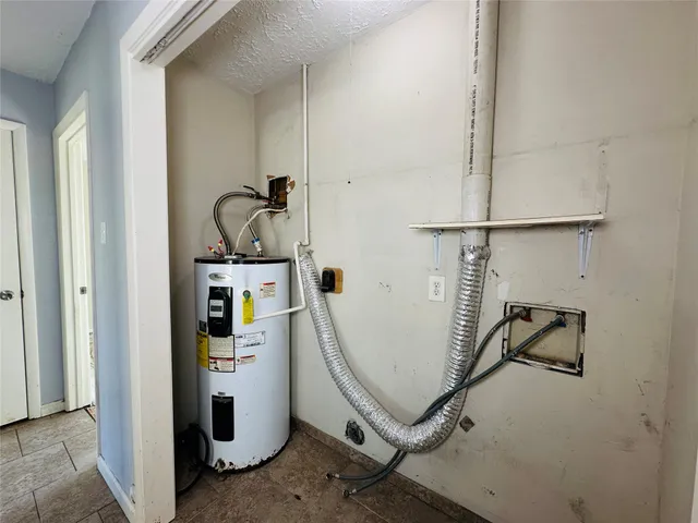 a room with gym equipment and white walls