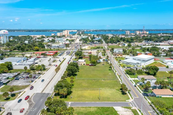 an aerial view of residential building and ocean view