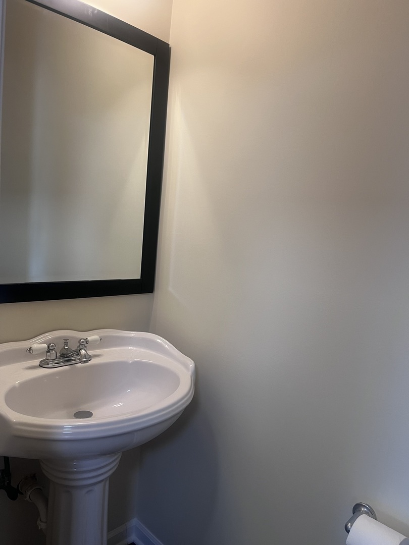 547 Goodwin Drive Bolingbrook, IL 60440 - Photo 11 of 36 a bathroom with a sink and a mirror