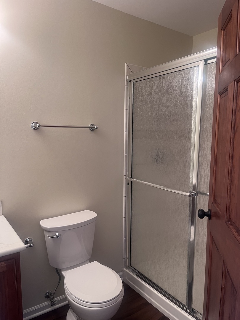 547 Goodwin Drive Bolingbrook, IL 60440 - Photo 21 of 36 a white toilet sitting next to a shower